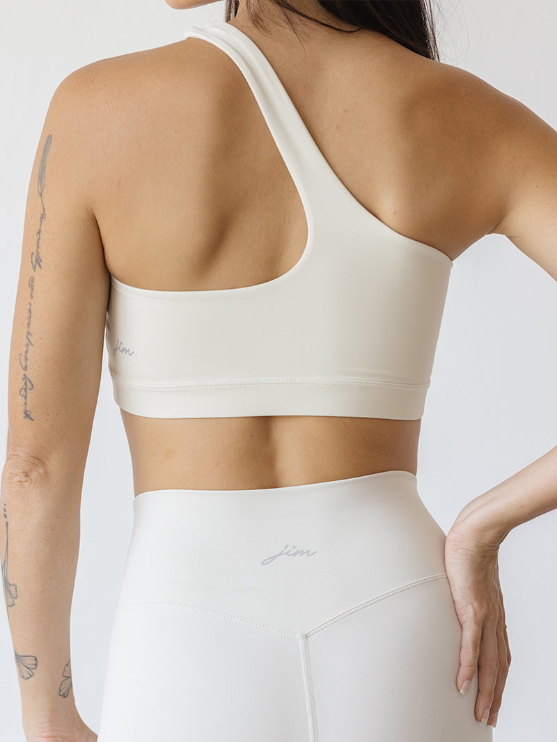 Asymetryczny biały stanik do jogi Vibe Out - widok z tyłu