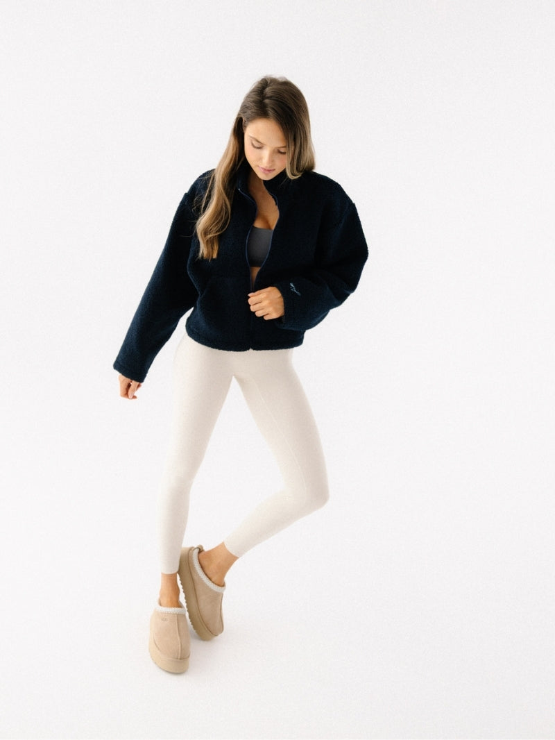 Damska rozpinana bluza polarowa w granatowym kolorze z serii Explore - set z kremowymi legginsami sportowymi