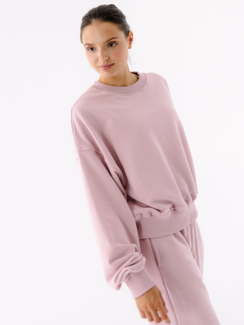 Szeroka damska bluza oversize w jasnoróżowym odcieniu z serii Spark
