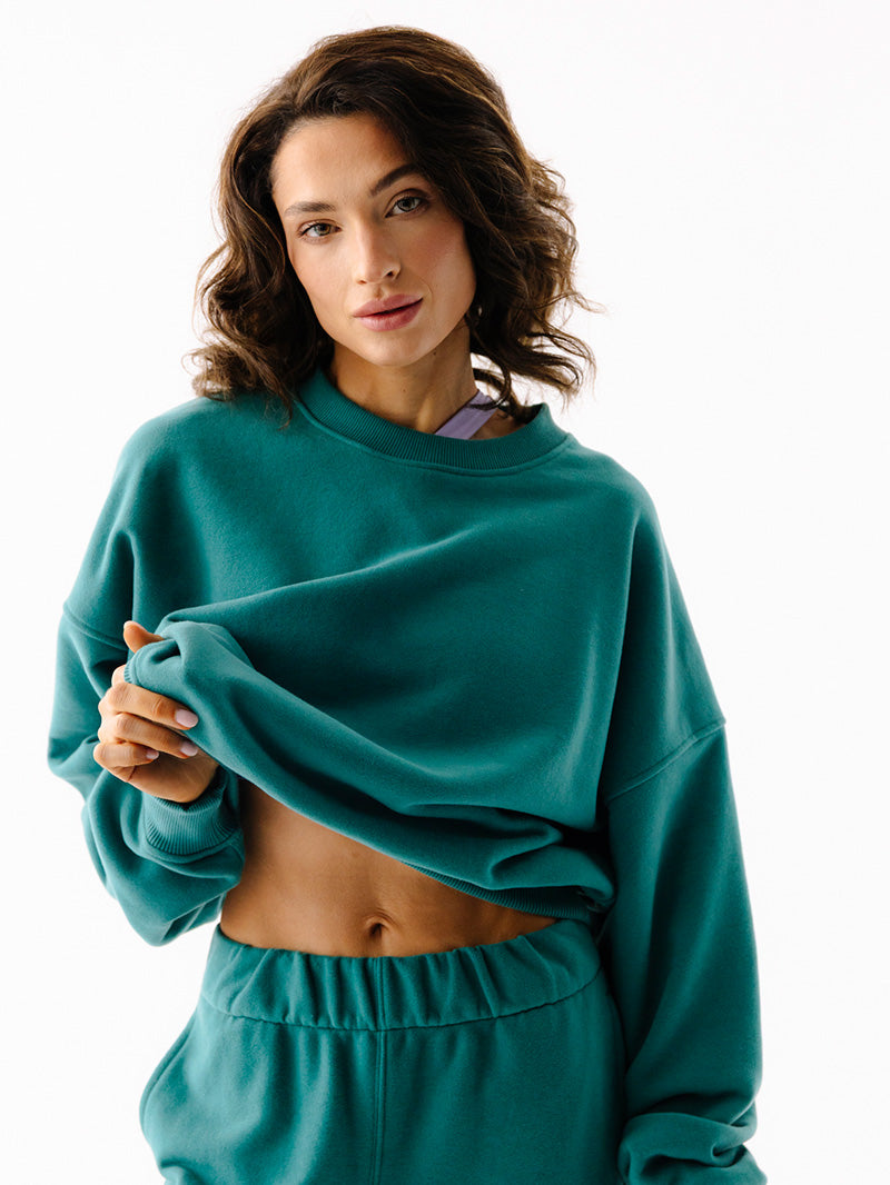 Zielona bawełniana damska bluza oversize - zbliżenie na krój