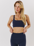 Granatowe damskie spodnie flare z szeroką nogawką - set z crop topem Navy