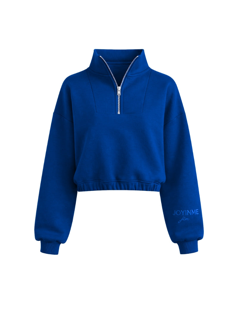 Kobaltowa oversize bluza damska typu half-zip wykonana z miękkiej bawełny - widok na rozpięty zamek
